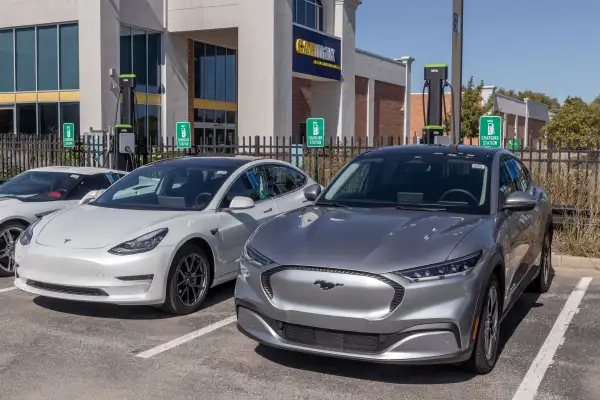 CarMax Auto Dealership Tesla and Mustang Mach-E display