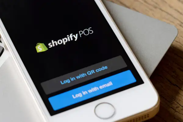 Close-up of a smartphone with the Shopify POS application