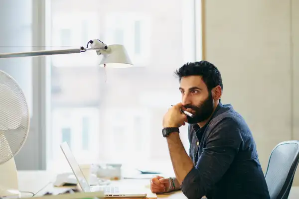 Man thinking at his desk