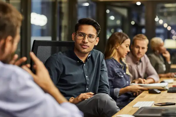 Employees at a conference room in an office