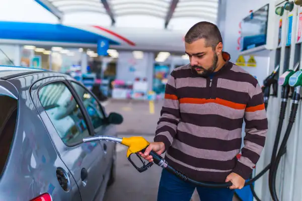 Man filling up his car with gas