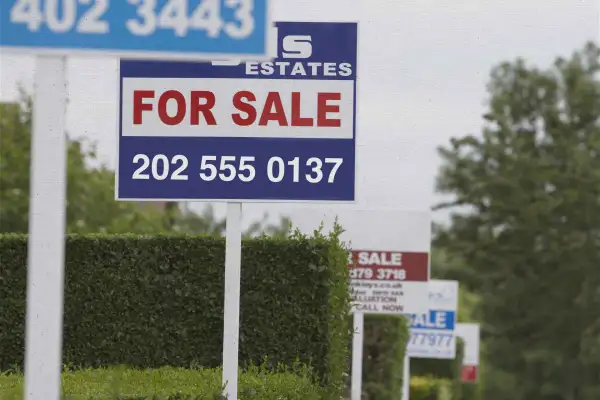 A row of for sale signs