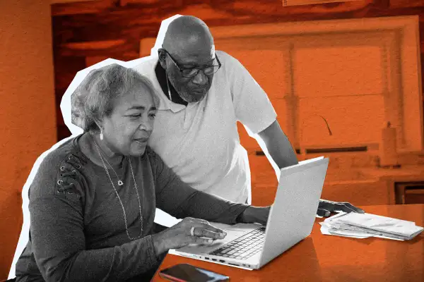 Picture of an old couple looking at their computer