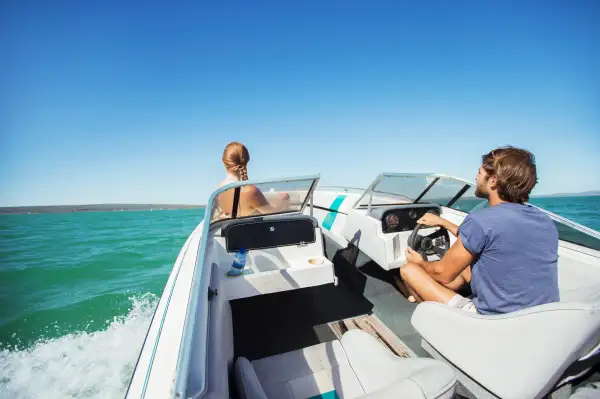 Couple on a small boat in the water