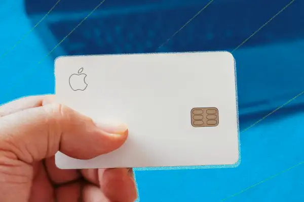 Hand holding the Apple Card credit card