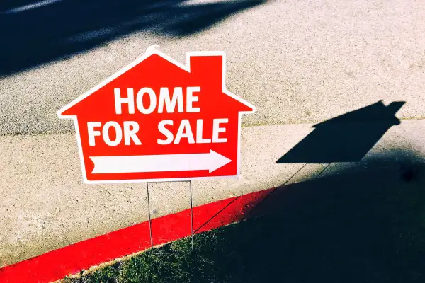 View of FOR SALE sign of a house