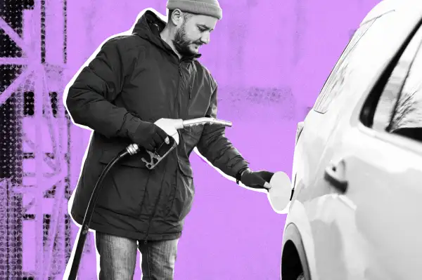 Man refueling his SUV with gasoline.