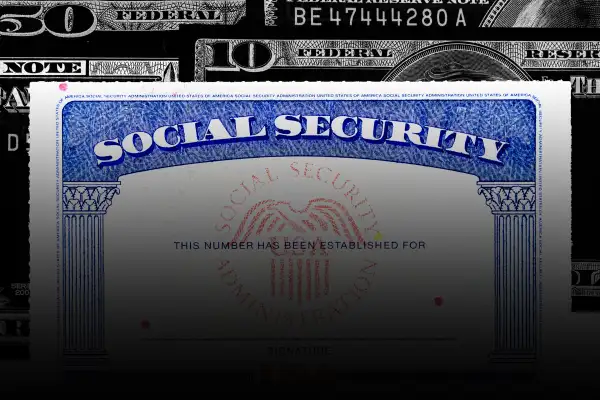 Photo collage of a social security card, with money in the background, fading into black