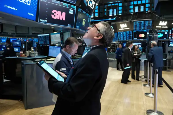 Traders work on the floor of the New York Stock Exchange