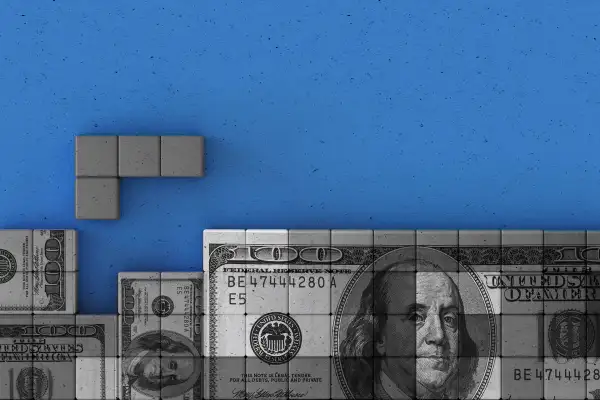 One hundred dollar bill as a puzzle Tetris in a blue background