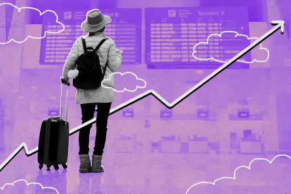 Person checking flight information at an airport terminal