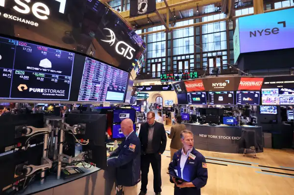 Traders work on the floor of the New York Stock Exchange in New York City