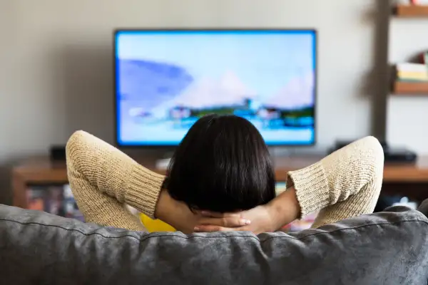 young woman watching television