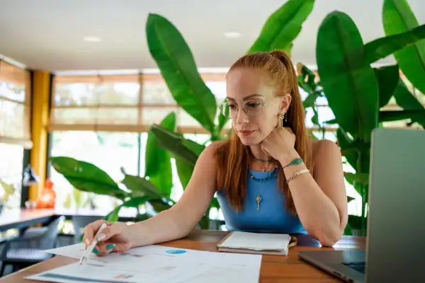 Woman working on financial reports in the office