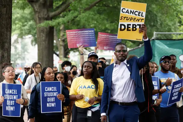 People for student debt relief demonstrate in front of the White House