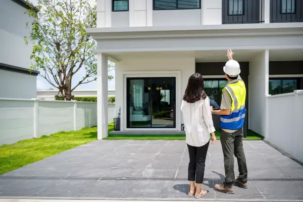 Photo of a woman looking at a newly constructed home