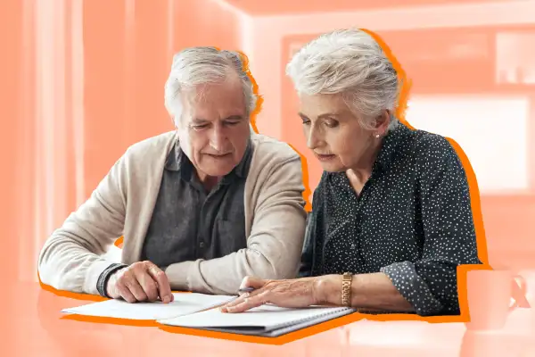 Senior couple look over insurance plans together