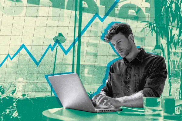 Photo illustration of a young investor using his laptop