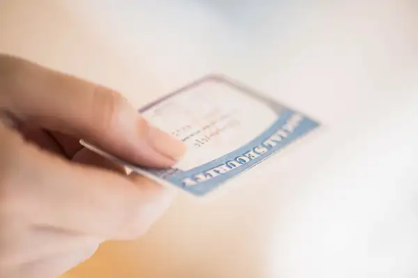 Person holding social security card