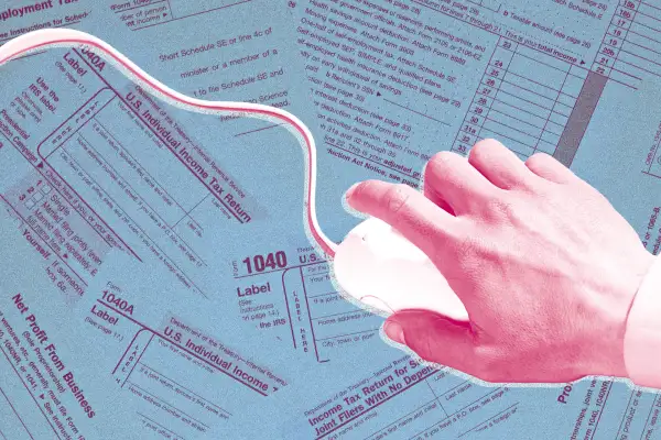 A hand with computer mouse on top of tax forms.