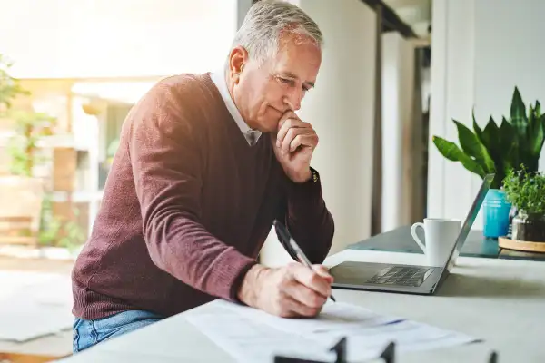 Man filling out tax forms