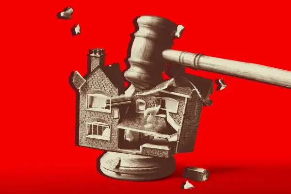 A gavel smashing a house.