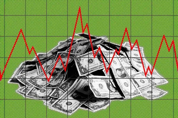 Photo illustration of a stack of dollar bills with a red line graph