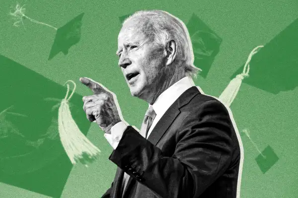 Biden giving a speech with graduation caps in the background.