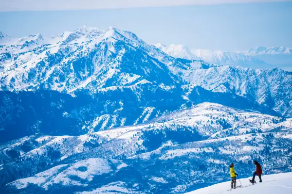 Picturesque mountains with two people skiing