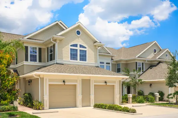 Cream colored house in a suburban neighborhood