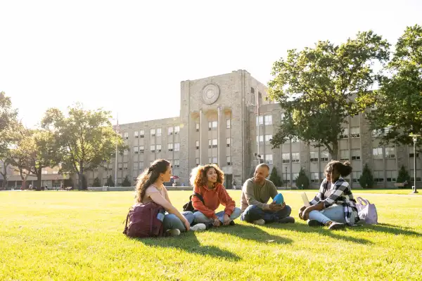 A photo of some college freshmen sitting on campus