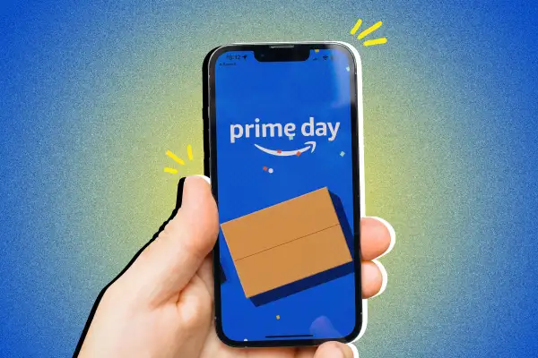 A hand holding a smart phone with Prime Day logo