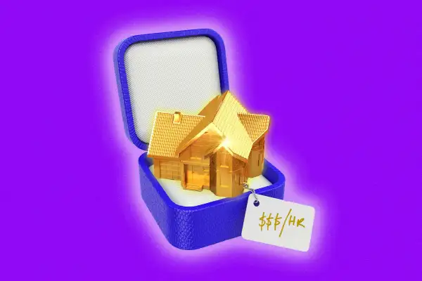 A jewelry box with a golden house glowing in it