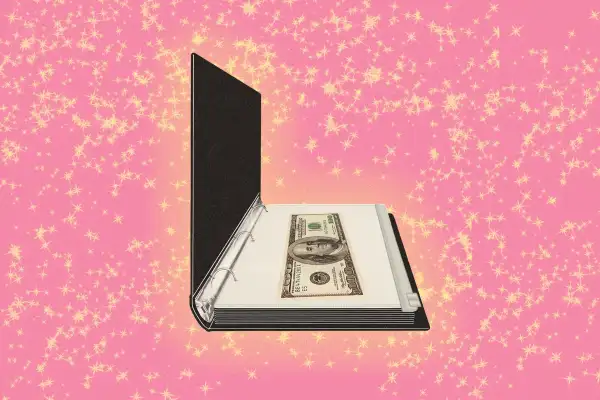 A binder with a money envelope on a sparkly background