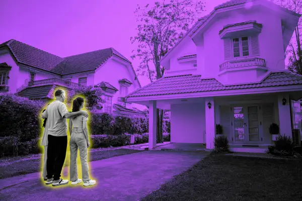 Family standing in-front of a suburban house