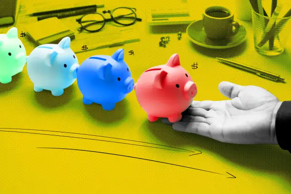 a series of piggy banks in a row on top of a working desk