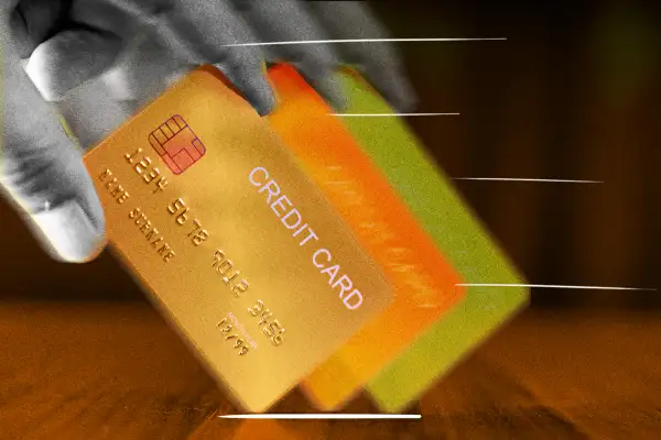 Close-up of a hand holding a credit card