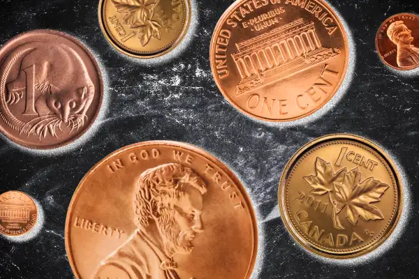 Close-up of US pennies, Canadien and Australian cents