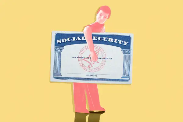 A figurine carrying an oversized social security card