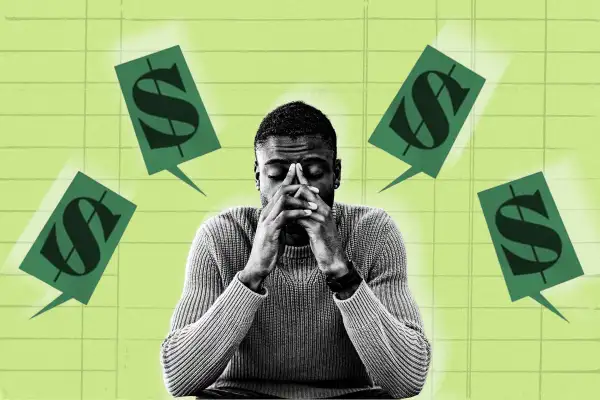 Man looking stressed with money sign speech bubbles around him